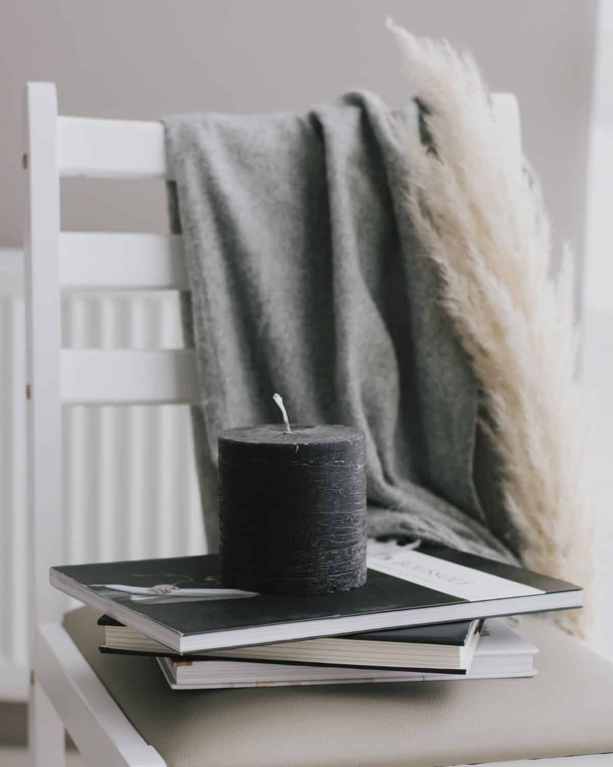 Image of a single, lit candle with a calm, steady flame, creating a warm and cozy ambiance.