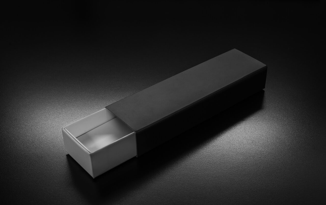 Opened black box against satin black