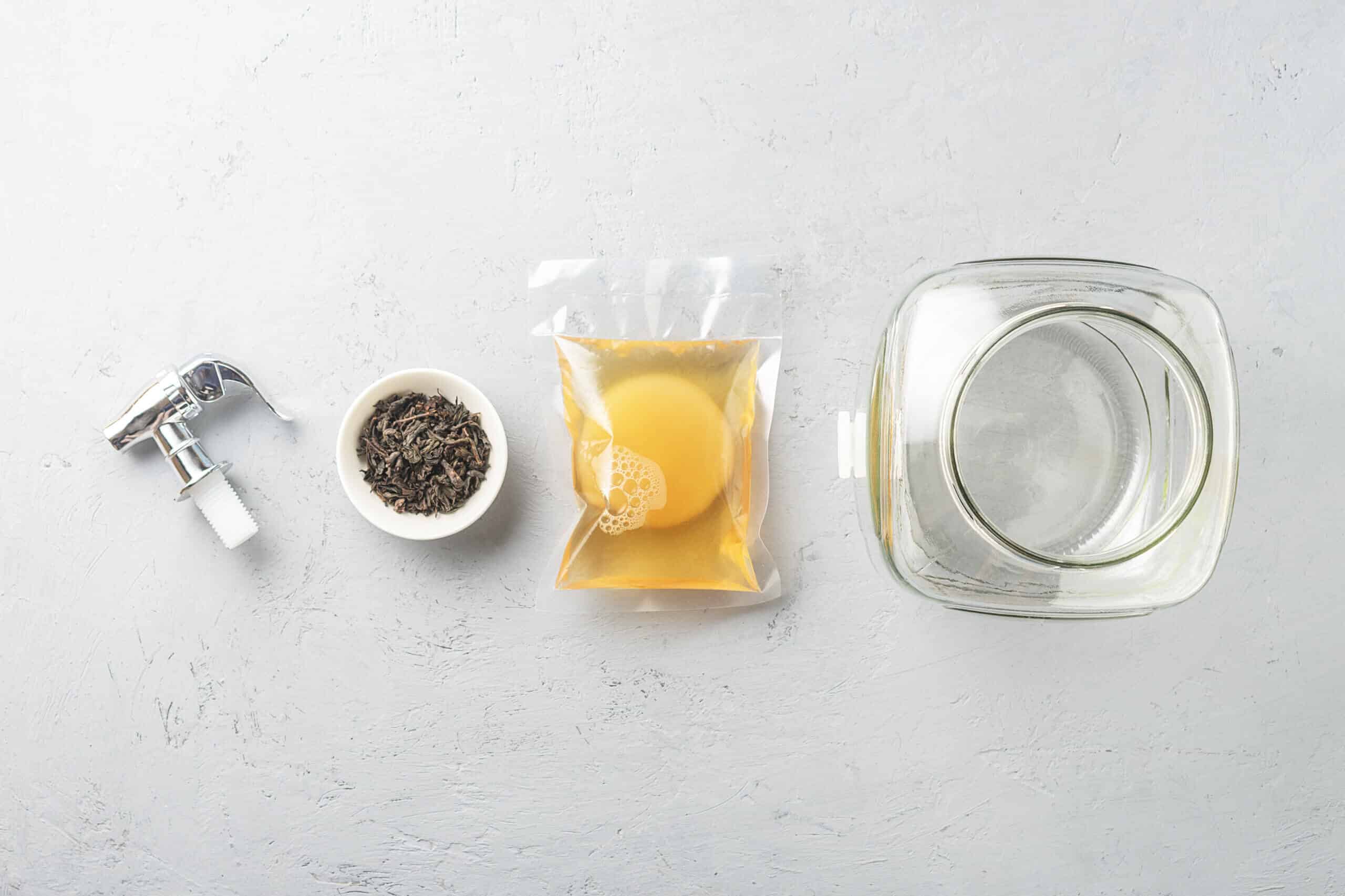 Kombucha in a package with ingredients for cooking. Fermented food.