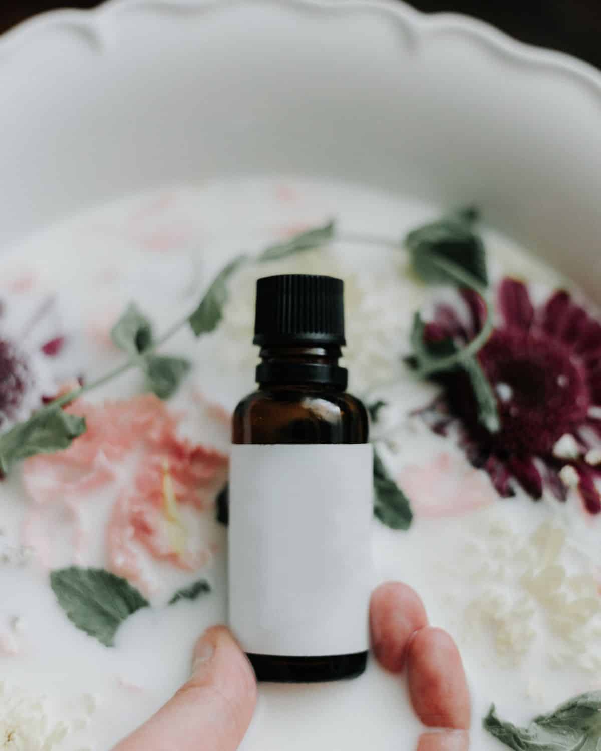 A clear glass bottle filled with face oil
