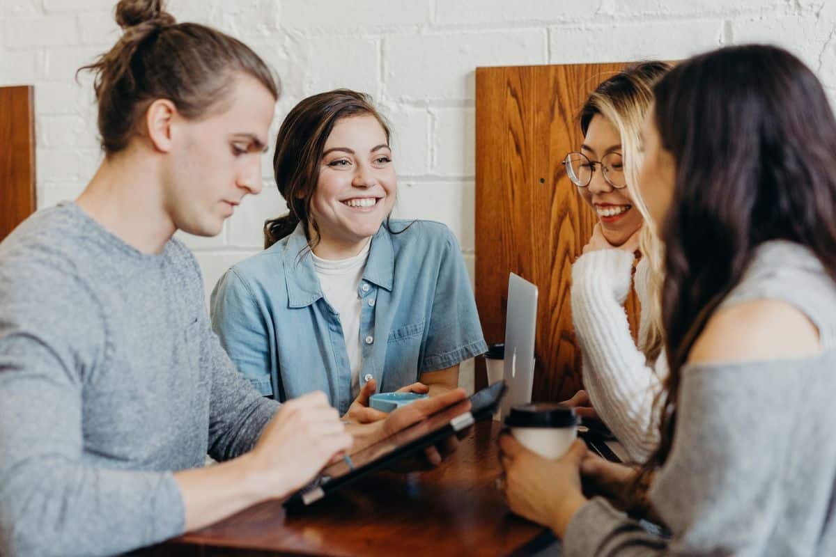 Group of professionals discussing and collaborating in an office setting, strengthening business connections.