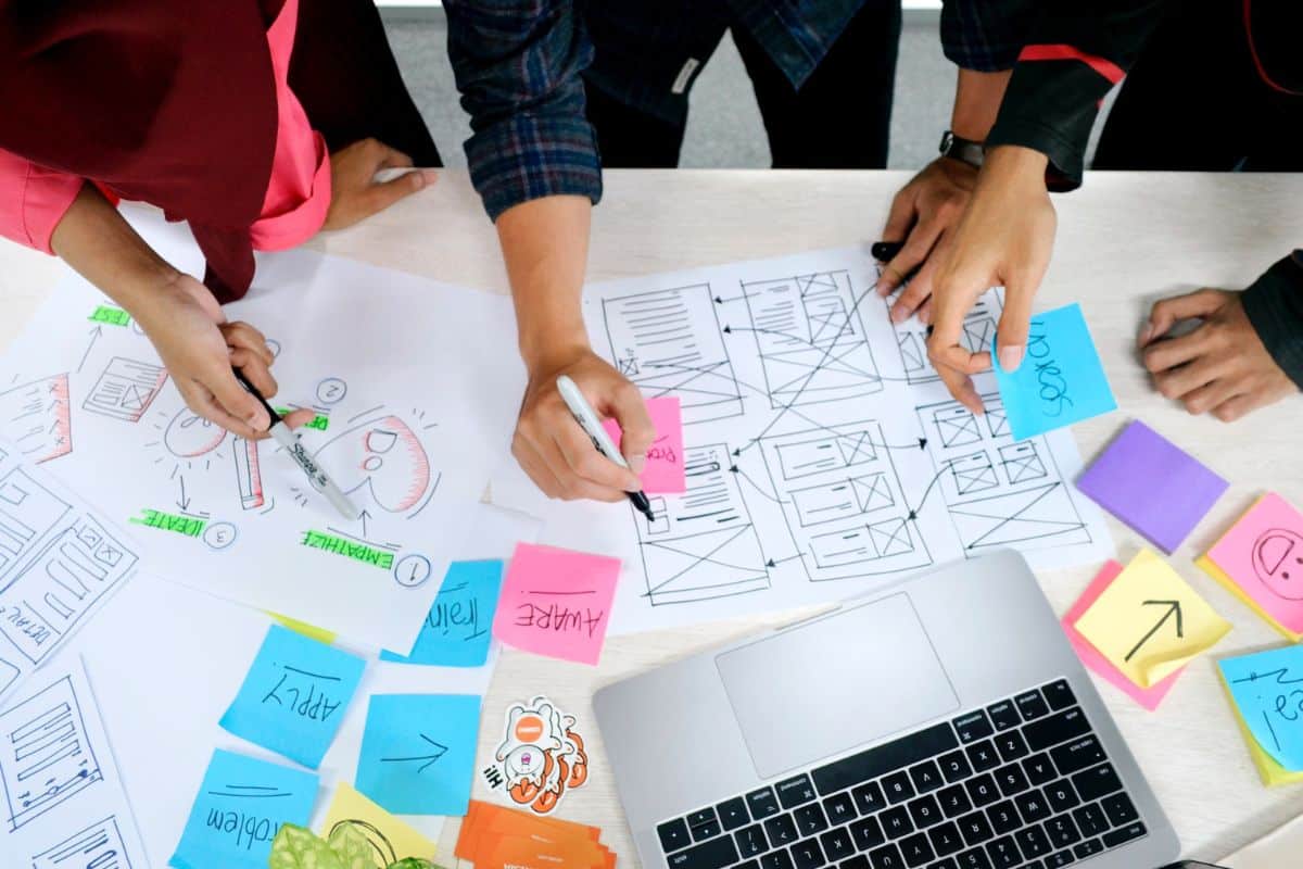 An organized workspace featuring a layout plan for a website, symbolizing the strategic planning process for a successful online presence.