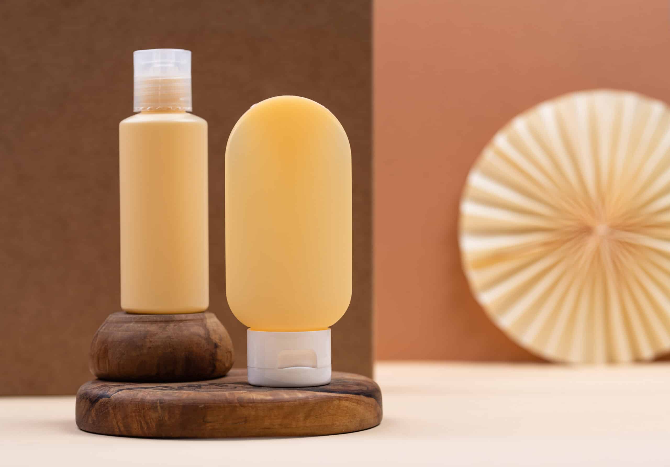 Empty cosmetic tube with wooden geometrical podiums
