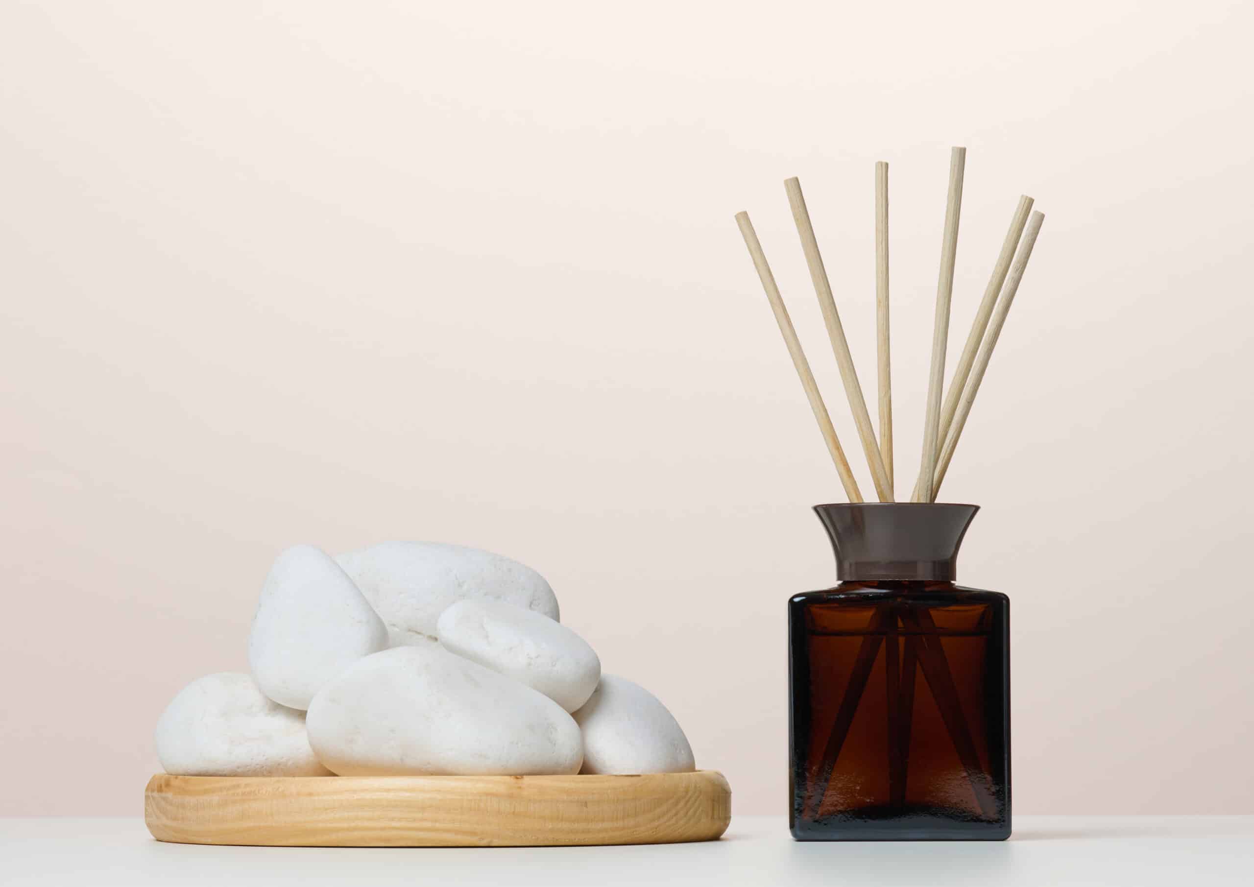Brown glass bottle and wooden sticks, home fragrance