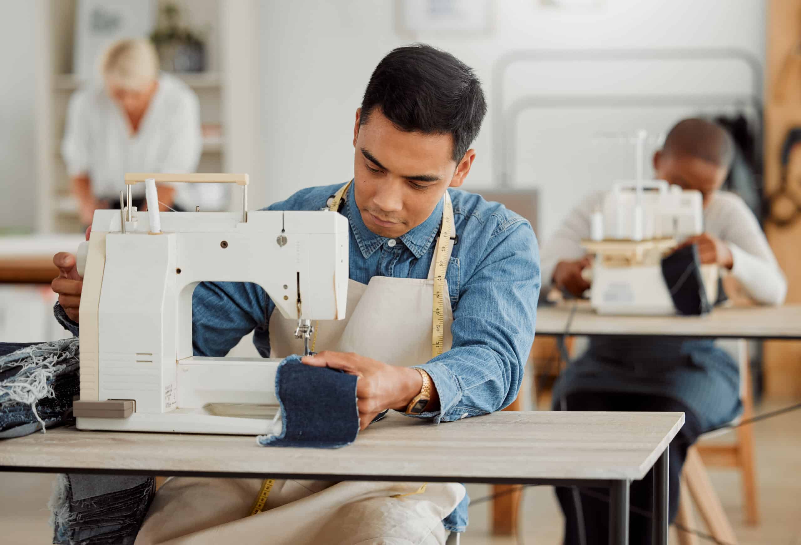A diligent man skillfully operating a sewing machine, representing the detailed work and expertise in European clothing manufacturing.