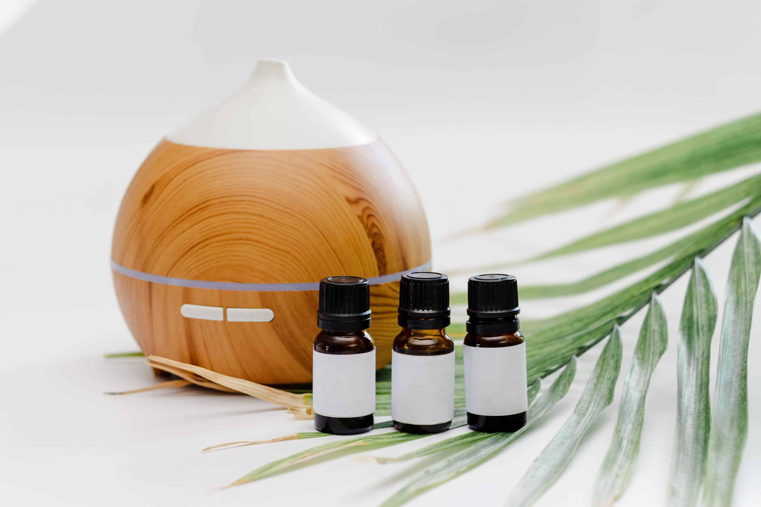 Essential oil of walnut on a wooden table.