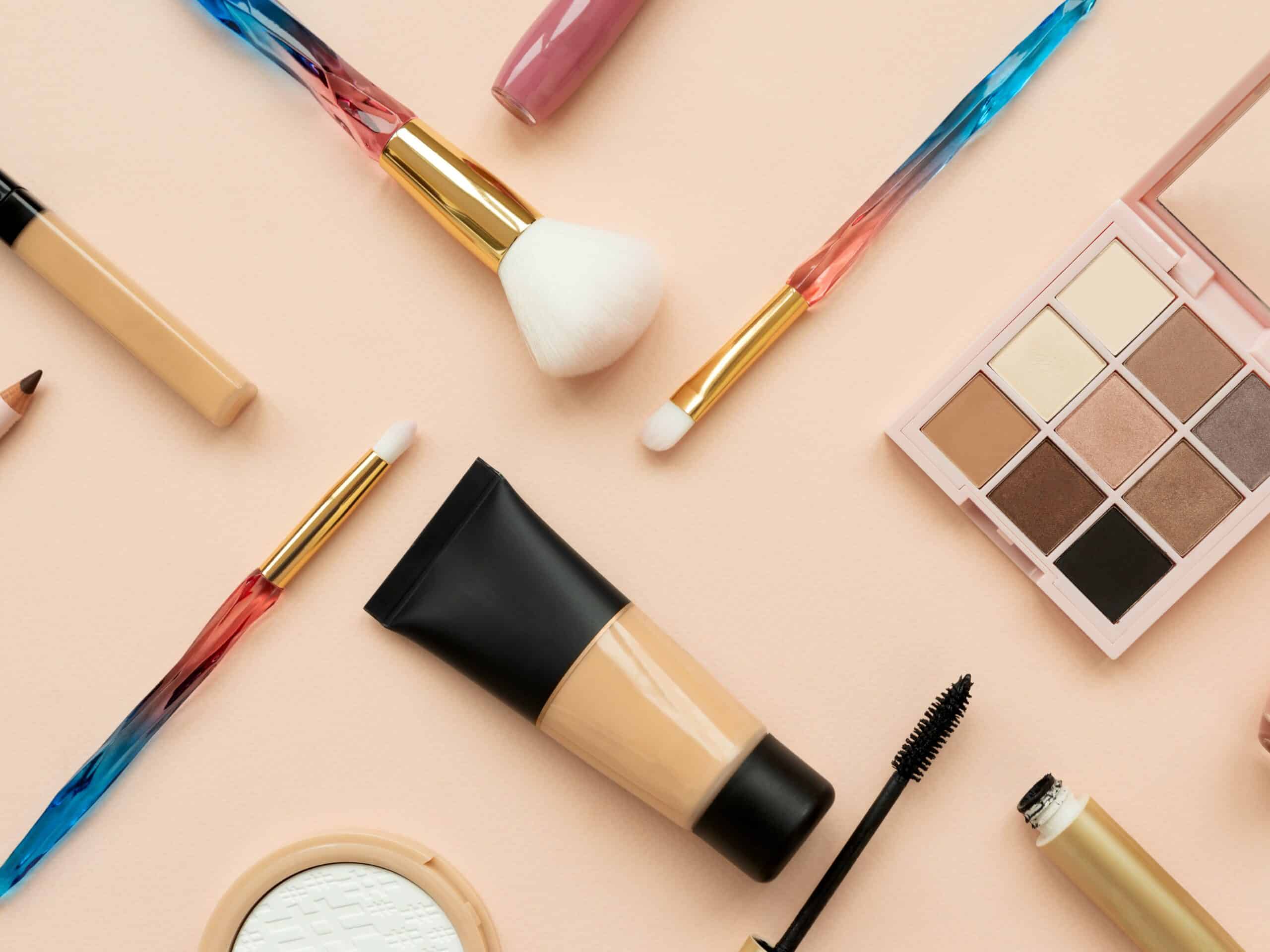 Set of cosmetics and accessories on pink background. Copy space. Flat lay. Top view. Skin care or morning routine concept