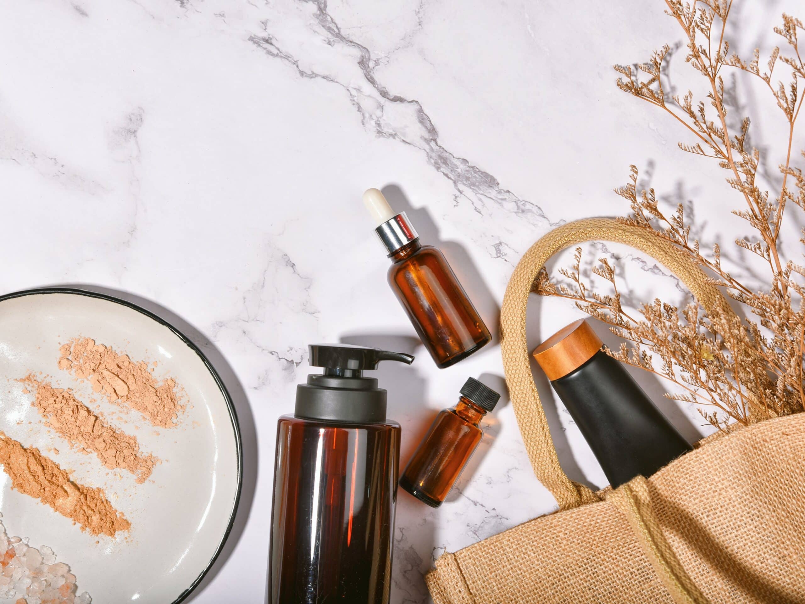 Natural organic powder makeup smear in open cotton bag, Reusable cosmetics glass package, Zero waste, Eco friendly and sustainable beauty products concept.