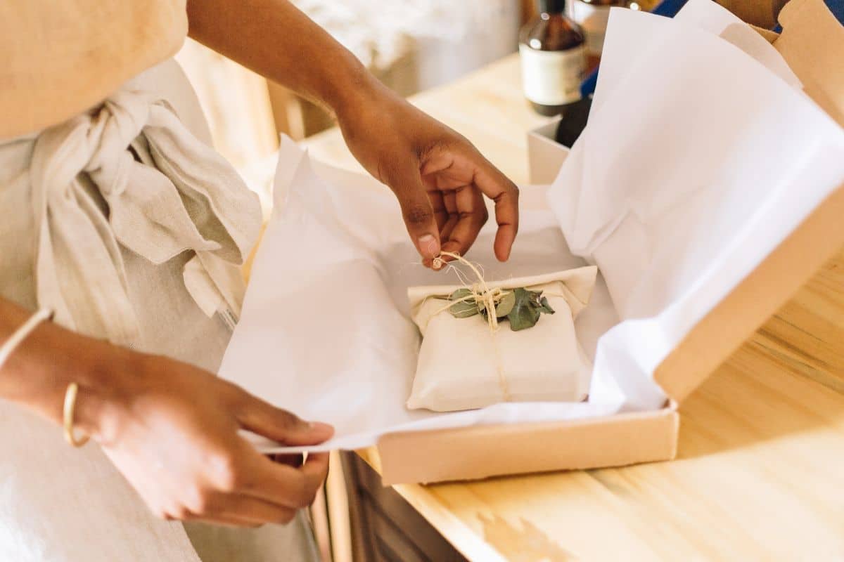 Woman packing her own private label brand of cosmetics