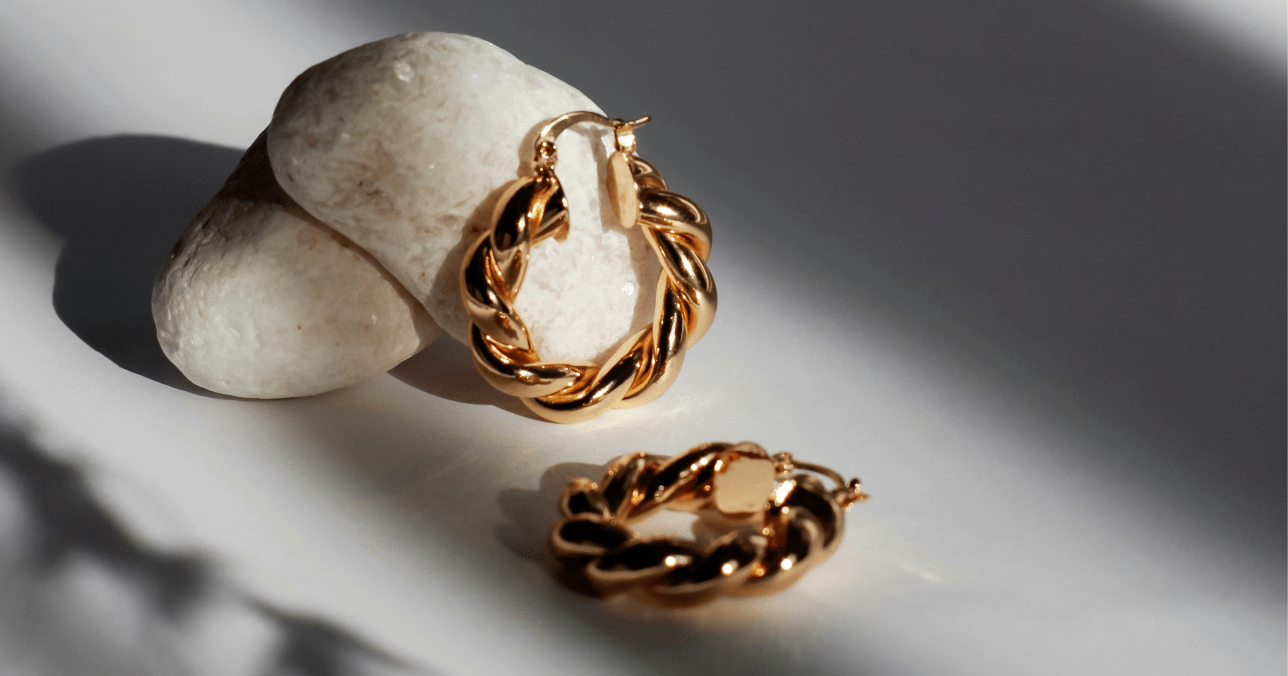 Two hoop earrings arranged.